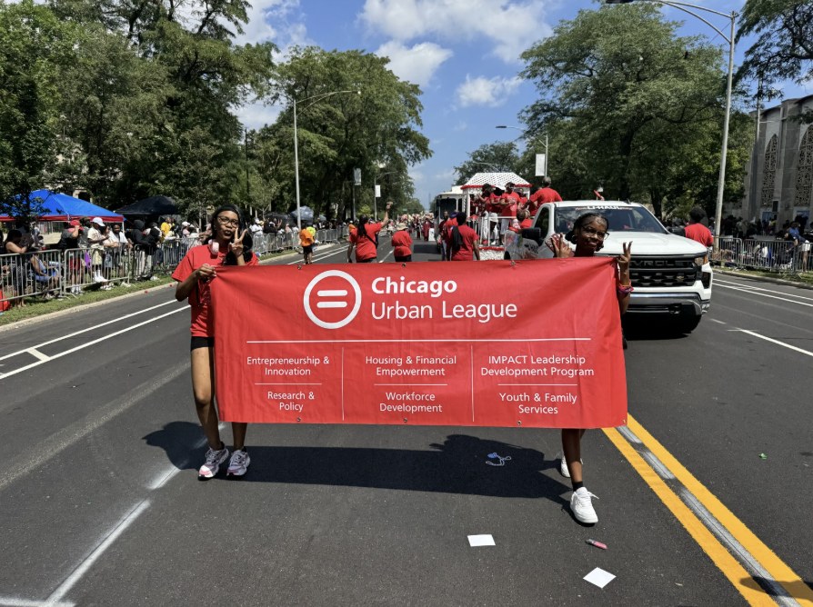 Chicago Urban League youth carrying the CUL banner at the Bud Billiken Parade