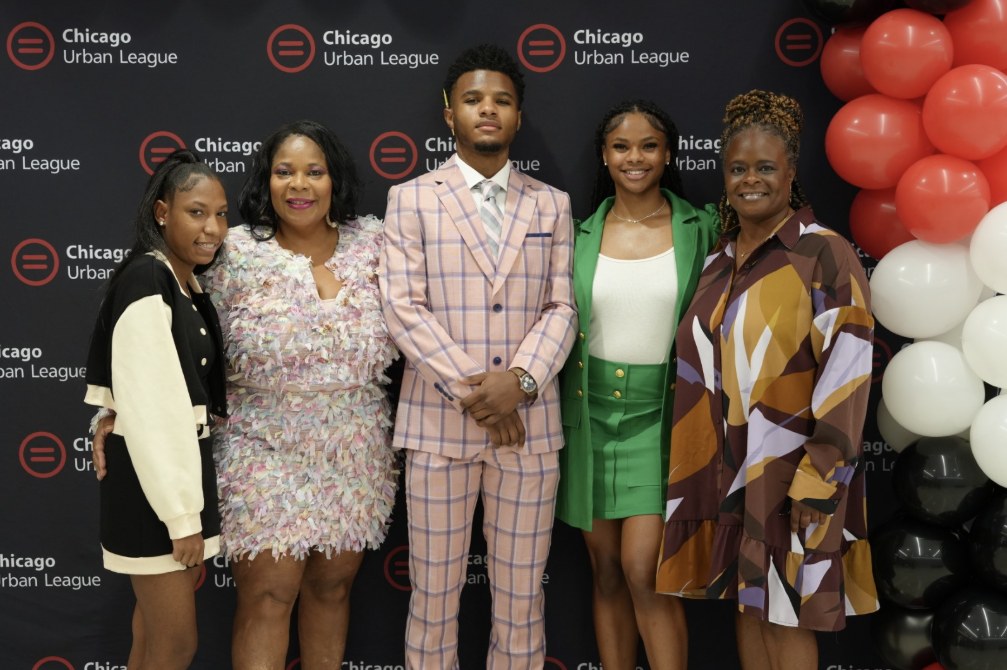 Chicago Urban League scholar and family at a youth celebration